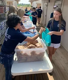 Volunteers Filling Weekend Meal Packs