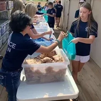 Volunteers Filling Weekend Meal Packs